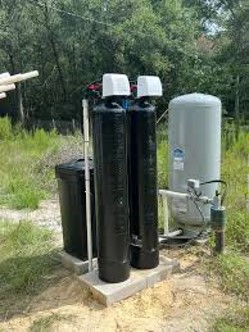 Outdoor water filtration system in natural setting.